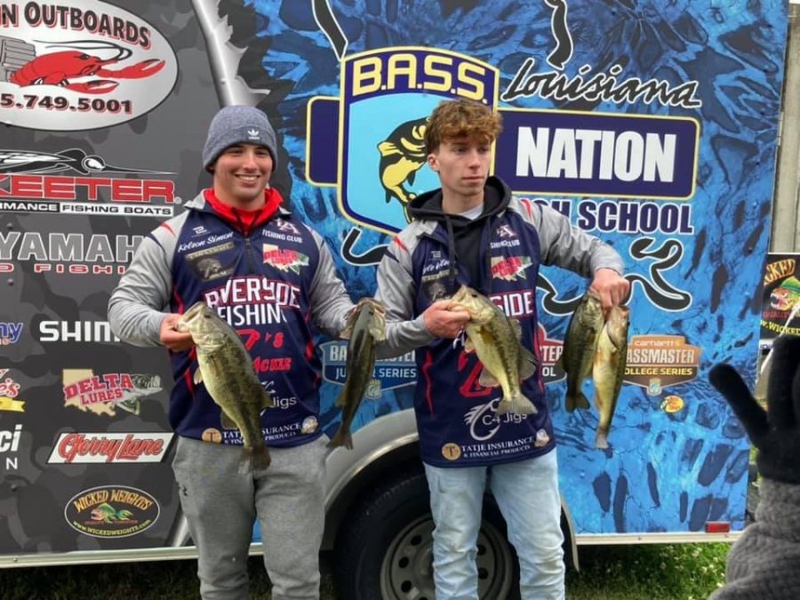RA fishers Kelson Simon, left, and Kyle Wilson show of their catch from the B.A.S.S. Fishing Tournament, which qualified them for State.