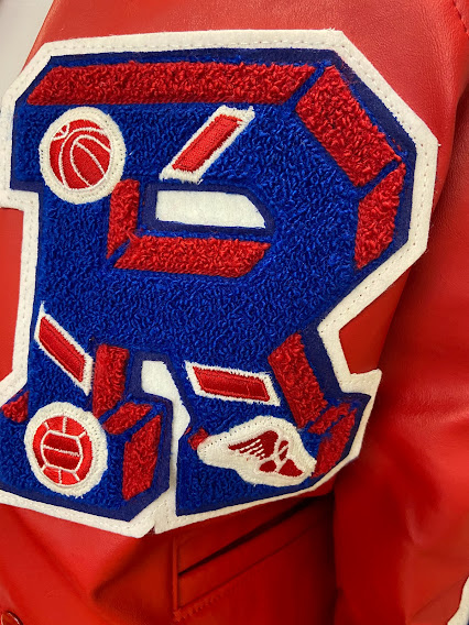 The traditional red letter R for Riverside is on the athletes letter jackets. 