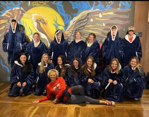 The RA swim team posed before the State Meet in their new Snuggies, a gift from Coach Christy Duhe. 