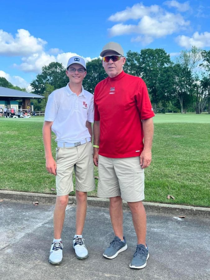 Cole Haase, left, and coach Mickey Roussel celebrate Hasses third place finish at the Division IV state golf tournament this week. 