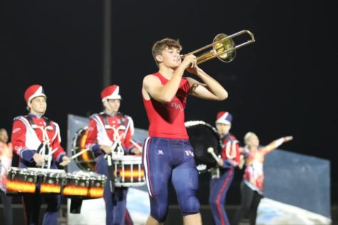 Freshman Cobey Wahden, who plays tight end on the football team, also performs with the band. 