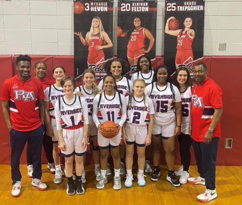 The Lady Rebels basketball team won the District 9-1A title with a 5-0 record. 