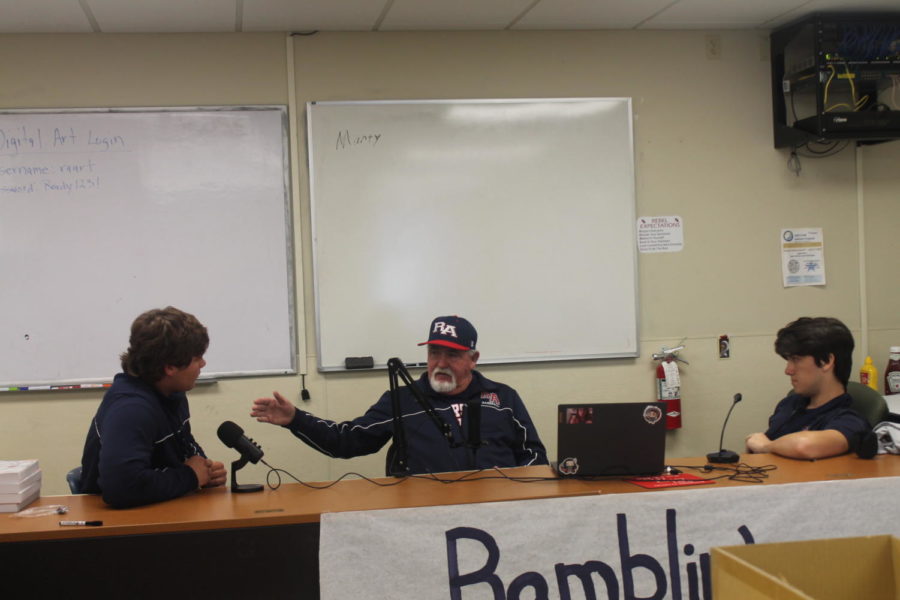 RA head baseball coach and athletic director Marty Luquet tells one of his many stories to Ramblin Rebels Podcast hosts Noah Trepagnier (left) and Lee Meyers (right). 