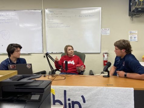 RA Principal Holly Haase, middle, talks to podcast hosts Lee Meyers, left, and Noah Trepagnier, right.