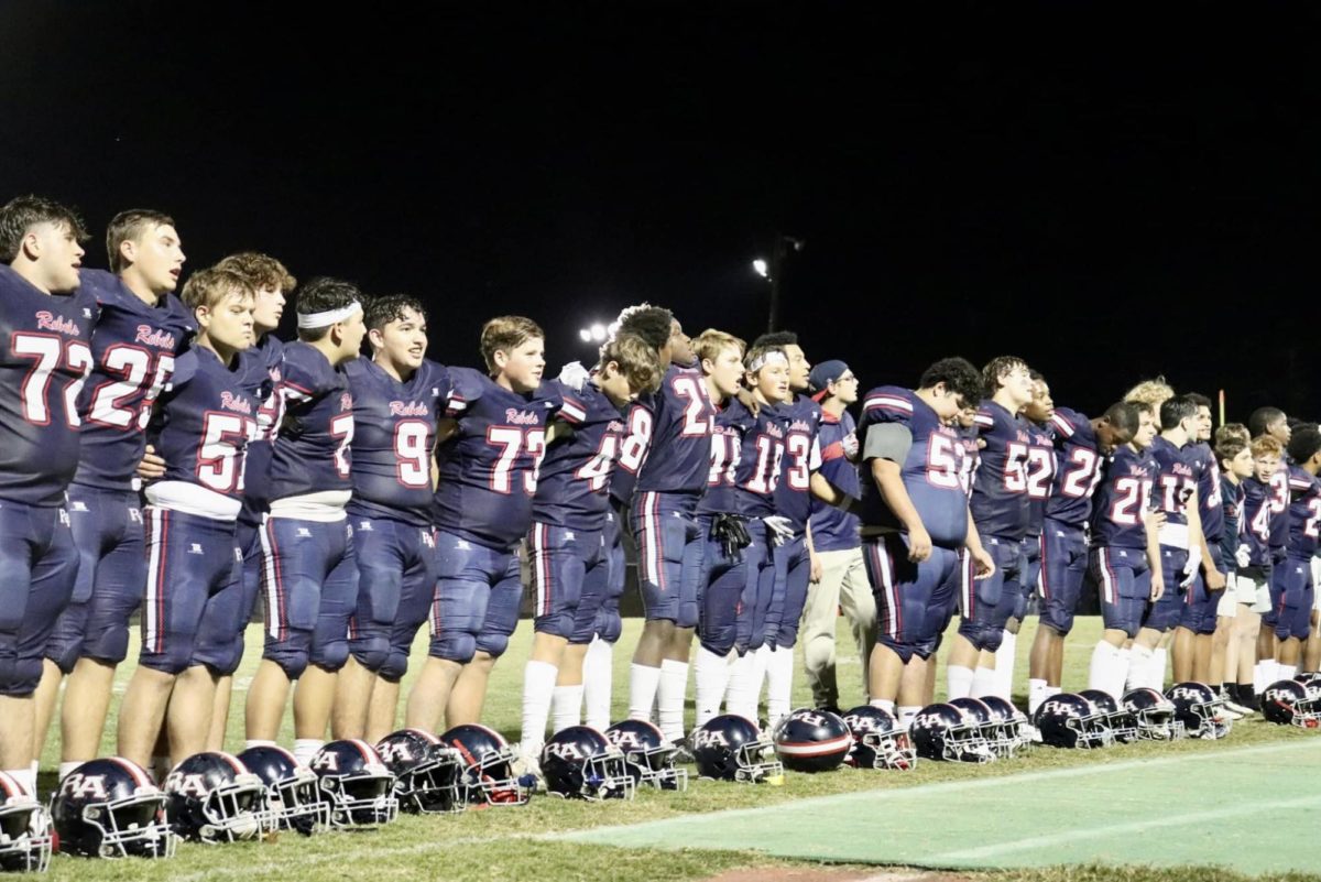 The Rebels sing the Alma Mater after Friday nights 55-0 win over West St. John 