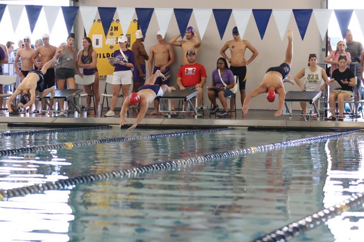Riverside Academys boys dive in for competition at a recent meet. 
