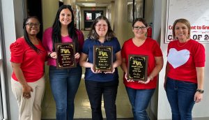 Assistant principal Dominique Zenon, left, and principal Holly Haase, right, pose with 2023-2024 teachers of the year, from left, Tori Lachney, Kathleen Trent and Erin Jung. 