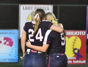 Riverside Academy senior Corrin Cashio, left, says goodbye to her beloved sport